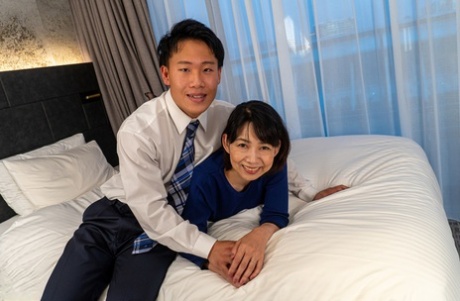 Mature Japanese woman has sex with her man friend while wearing OTK hosiery