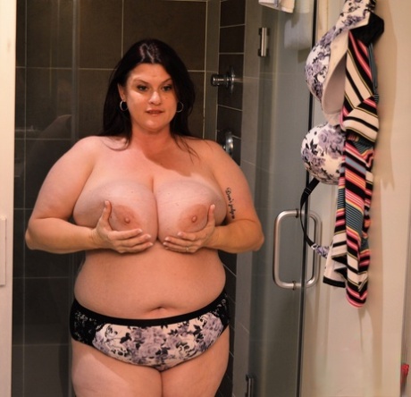 Gorgeous MILF fatty Kimmie Kaboom showering her big natural tits with milk