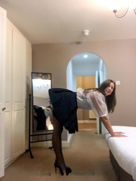 Hot MILF Lara shows her big boobs while trying on various sexy lingerie sets